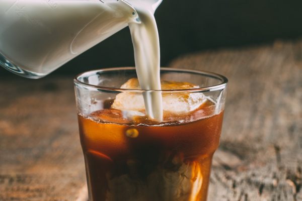 Ice cold brew coffee on wooden background